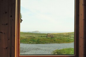 Múlafossur Cottages near Waterfall