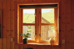 Múlafossur Cottages near Waterfall