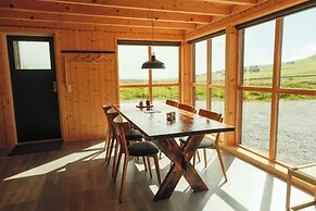 Múlafossur Cottages near Waterfall