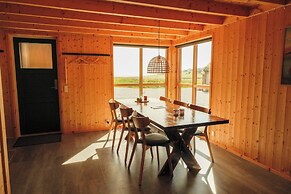 Múlafossur Cottages near Waterfall