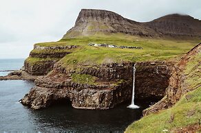 Múlafossur Cottages near Waterfall