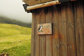 Múlafossur Cottages near Waterfall