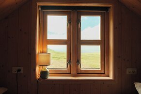 Múlafossur Cottages near Waterfall