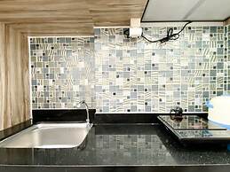 Homey And Compact Studio At Azalea Suites Apartment