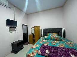 OYO 93308 Lima Saudara Syariah