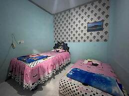 OYO 93308 Lima Saudara Syariah