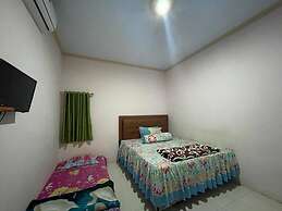 OYO 93308 Lima Saudara Syariah