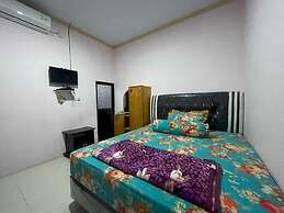 OYO 93308 Lima Saudara Syariah