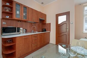 Studio centrum Poznań by Renters