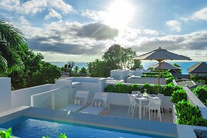 Palm Grove Villas & Hotel