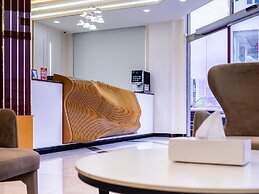 OYO Townhouse 156 Rose Hotel Apartments.