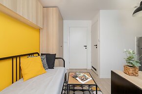 Yellow and Grey Studio by Renters