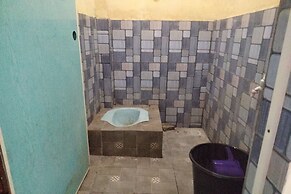 SPOT ON 93460 Lewi Family Guest House Near GBKP Bangun Mulia Km. 11