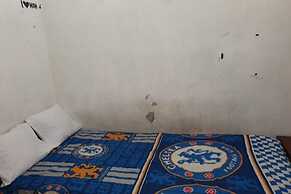 SPOT ON 93460 Lewi Family Guest House Near GBKP Bangun Mulia Km. 11