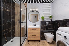 Dark Blue Apartment in Kraków by Renters