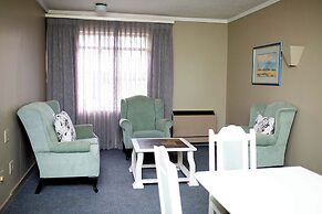 Q's Evander Hotel and Apartment