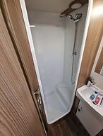 Brand new Touring Caravan Sited all Setup Ready