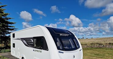Brand new Touring Caravan Sited all Setup Ready