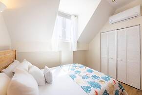 Historic Heartbeat 2BR Townhouse in Central Bliss