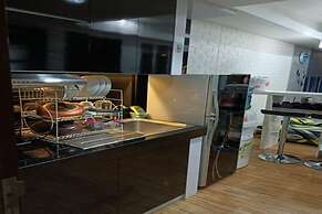 Capital O 93636 La Grande Apartment By UJM