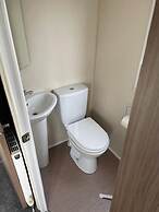 Premium 2 bed Caravan Sleeps 6 With Huge Decking