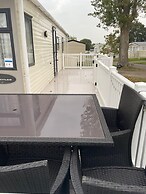 Premium 2 bed Caravan Sleeps 6 With Huge Decking