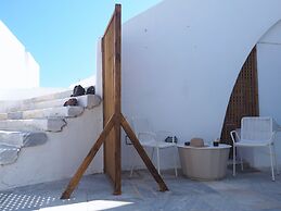 The Palm Rock Finikia Santorini