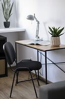 Grey Apartment Śródmieście by Renters