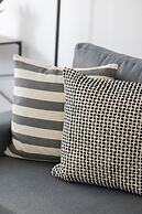 Grey Apartment Śródmieście by Renters