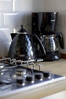 Grey Apartment Śródmieście by Renters