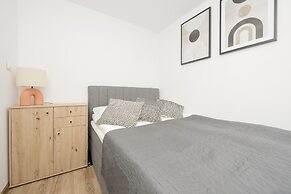 Grey Apartment Śródmieście by Renters