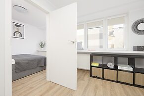 Grey Apartment Śródmieście by Renters