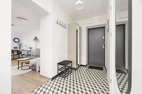 Grey Apartment Śródmieście by Renters