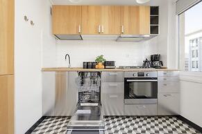 Grey Apartment Śródmieście by Renters