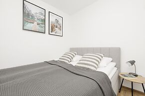 Grey Apartment Śródmieście by Renters