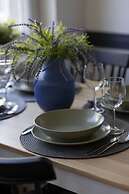 Grey Apartment Śródmieście by Renters