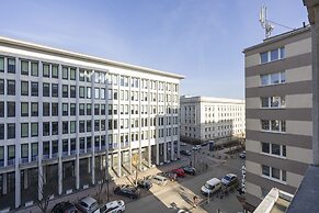 Grey Apartment Śródmieście by Renters