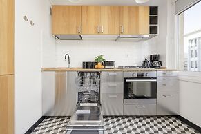 Grey Apartment Śródmieście by Renters