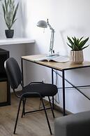 Grey Apartment Śródmieście by Renters