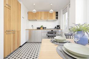 Grey Apartment Śródmieście by Renters