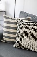 Grey Apartment Śródmieście by Renters