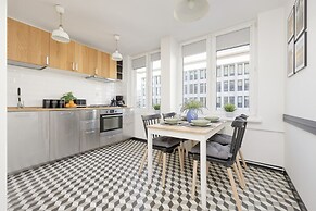 Grey Apartment Śródmieście by Renters
