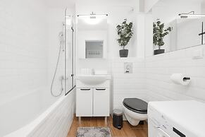 Grey Apartment Śródmieście by Renters