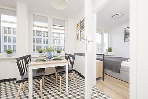 Grey Apartment Śródmieście by Renters