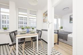 Grey Apartment Śródmieście by Renters