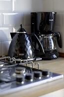 Grey Apartment Śródmieście by Renters