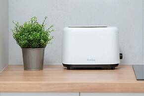 Minimalist Studios in Poznań by Renters