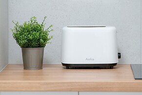 Minimalist Studios in Poznań by Renters