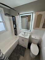 Spacious Retreat Near Convention Centers 4 Bedroom Home by RedAwning