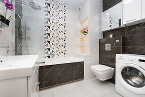 Apartment Manufaktura Łódź by Renters